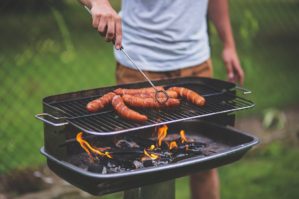 Man barbecuing outside Man barbecuing outdoors