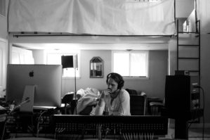 Man on computer in studio apartment